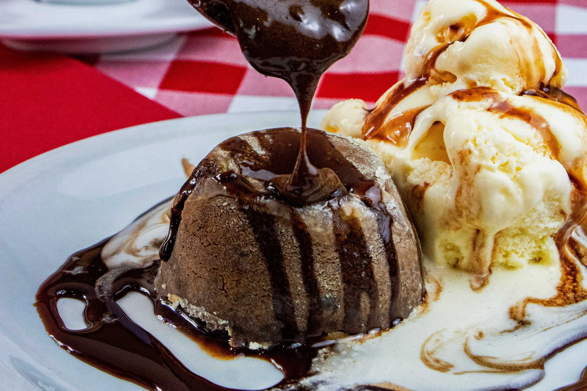 toffee pudding with ice cream and chocolate sauce