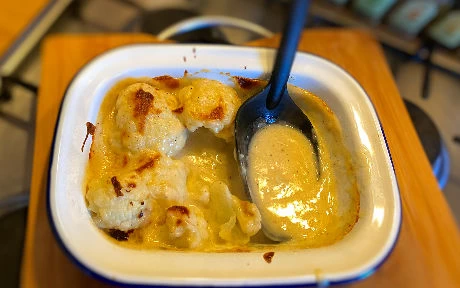cauliflower cheese in a tin oven dish