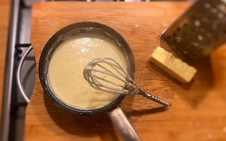 a pan of cheese sauce