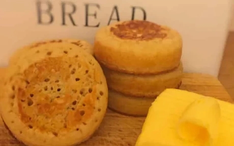 stack of crumpets with a block of butter