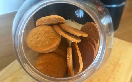 digestive biscuits in a plastic biscuit barrel