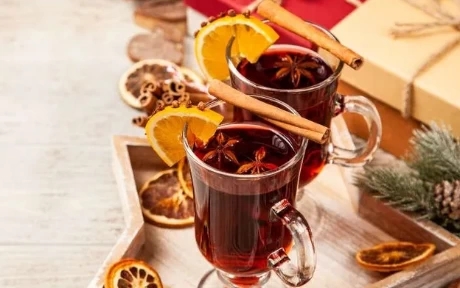two glasses of mulled wine with spices
