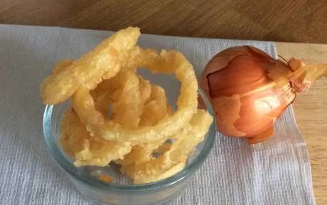 bowl of battered onion rings