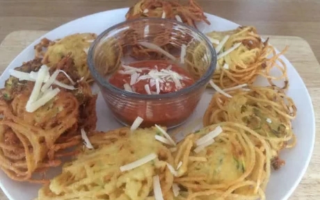 plate of spaghetti fritters and dip