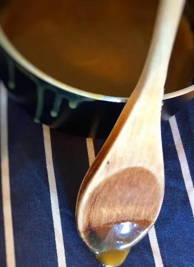 caramel sauce on a wooden spoon